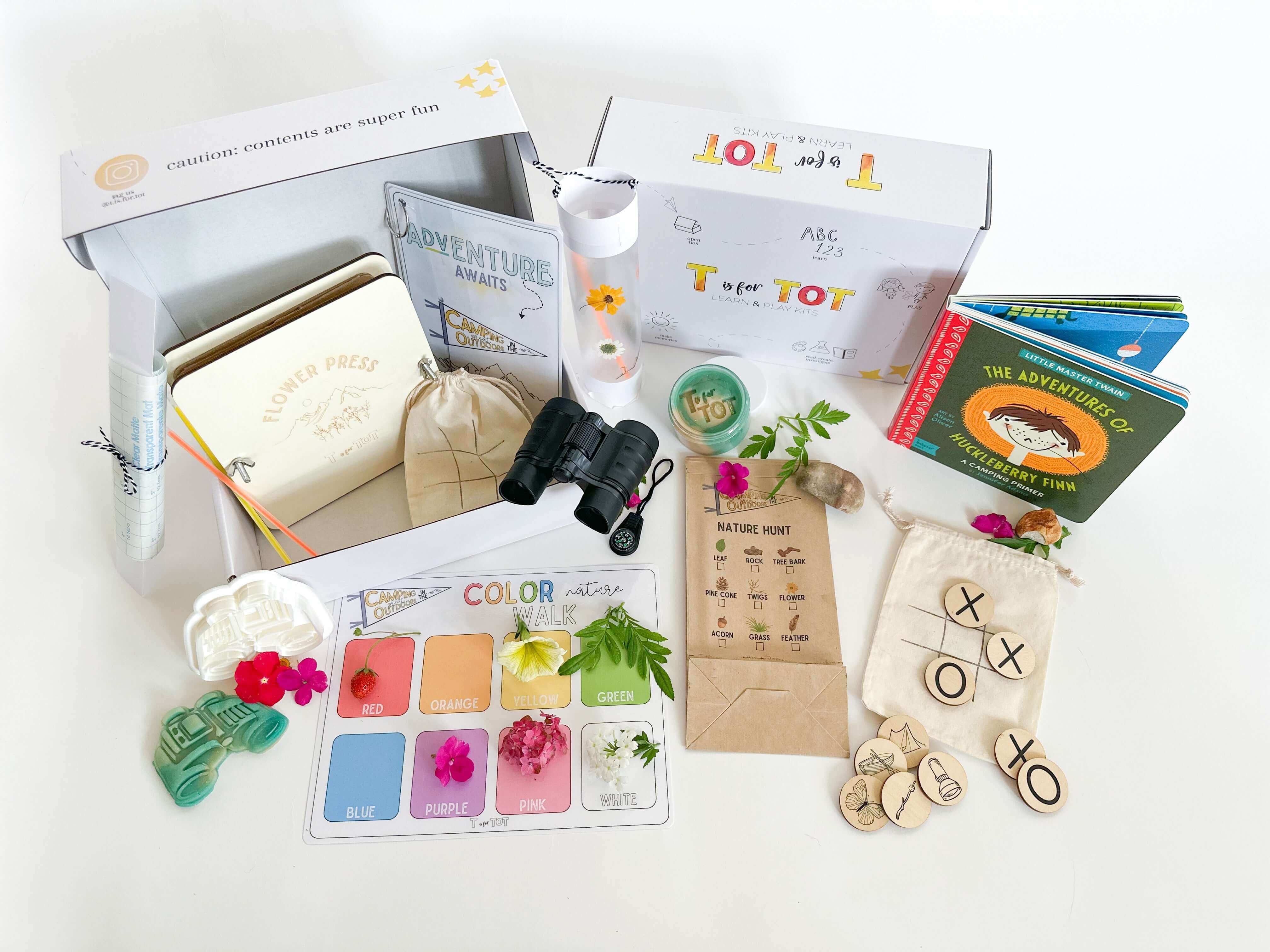 Camping in the Great Outdoors Kit with nature exploration tools, binoculars, flower press, and activity cards.